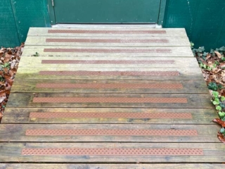 deck-treads-chestnut-brown-on-treated-wood-ramp-shed-door-client-handitreads-600px