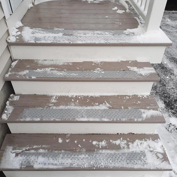 https://handitreads.com/wp-content/uploads/2022/09/aluminum-non-slip-treads-new-england-gray-snow-trex-stairs-porch-handitreads-750px.jpg