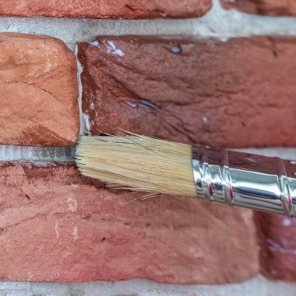 Brush textured sealant directly onto bricks