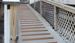 Chestnut Brown treads on wood and concrete wheelchair ramp